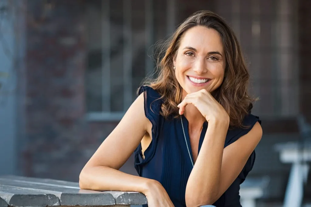 Mature woman with dentures smiling